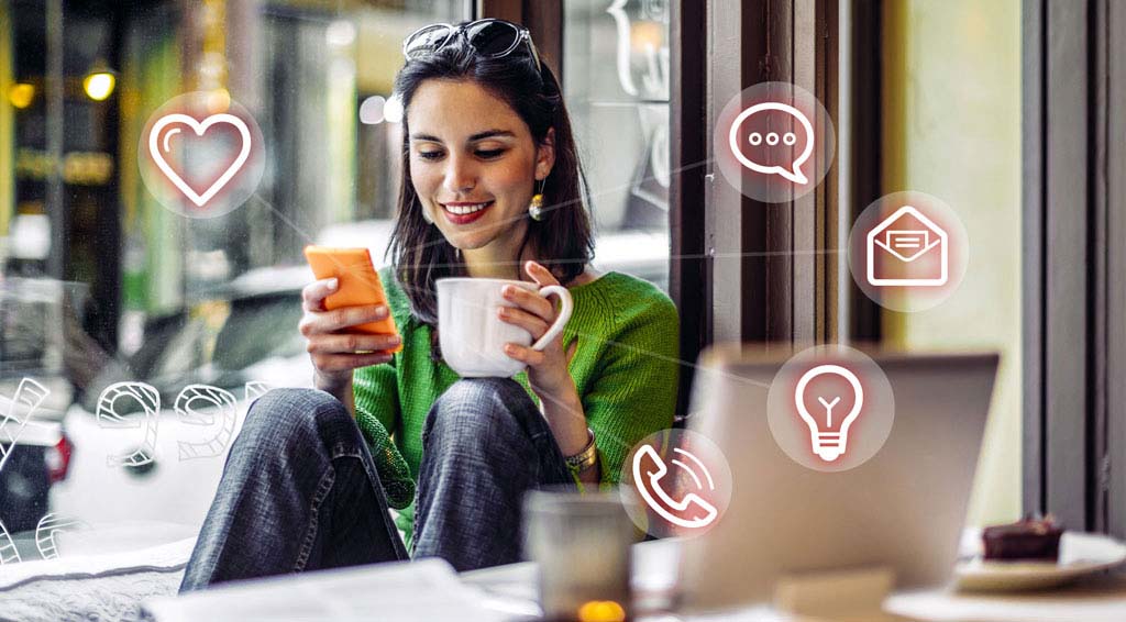 woman managing business calls at coffee shop